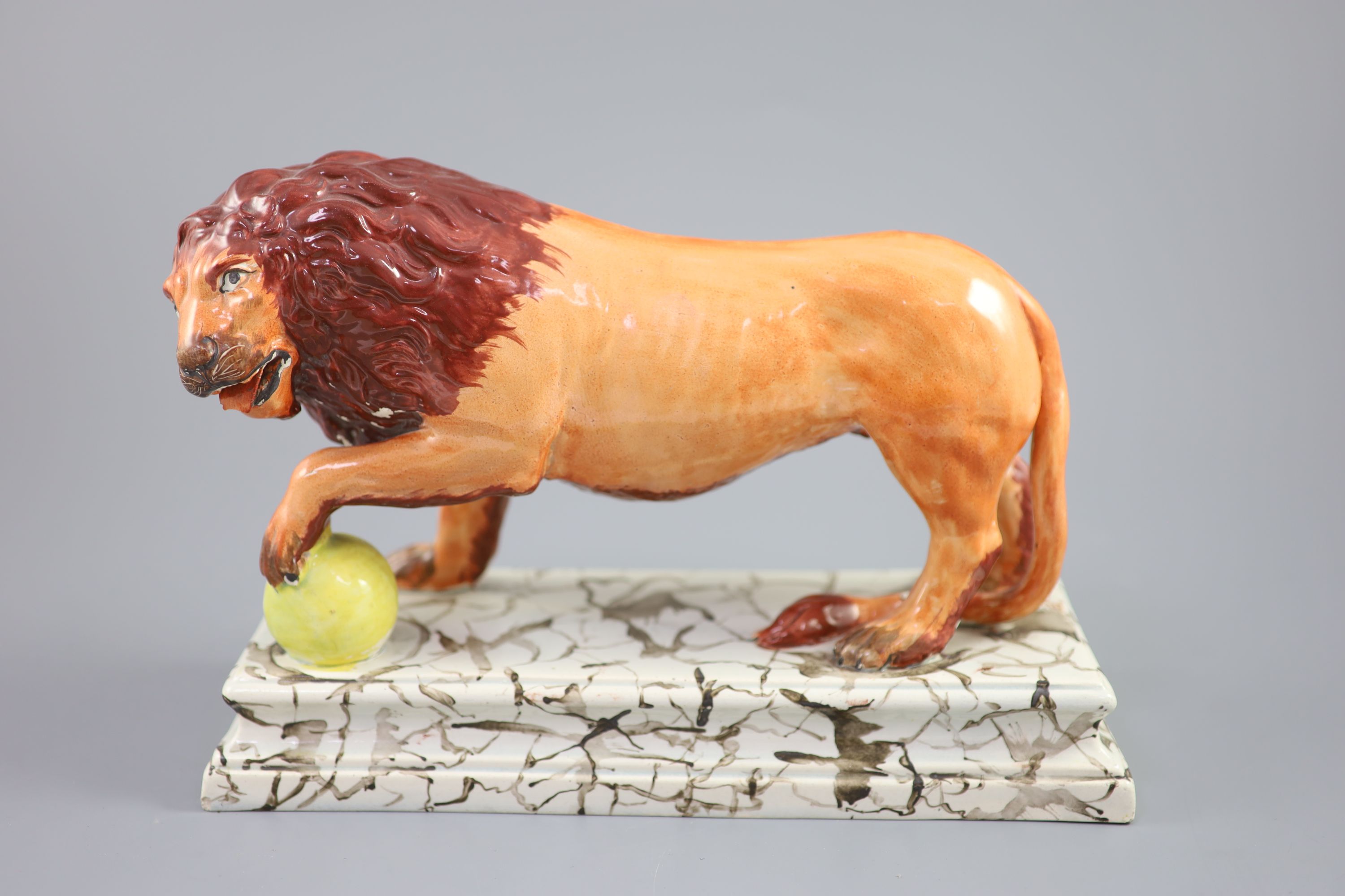 An Enoch Wood pearlware figure of a Medici Lion, c.1800-10, 28cm long